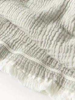 Copriletto in cotone con frange Kailani